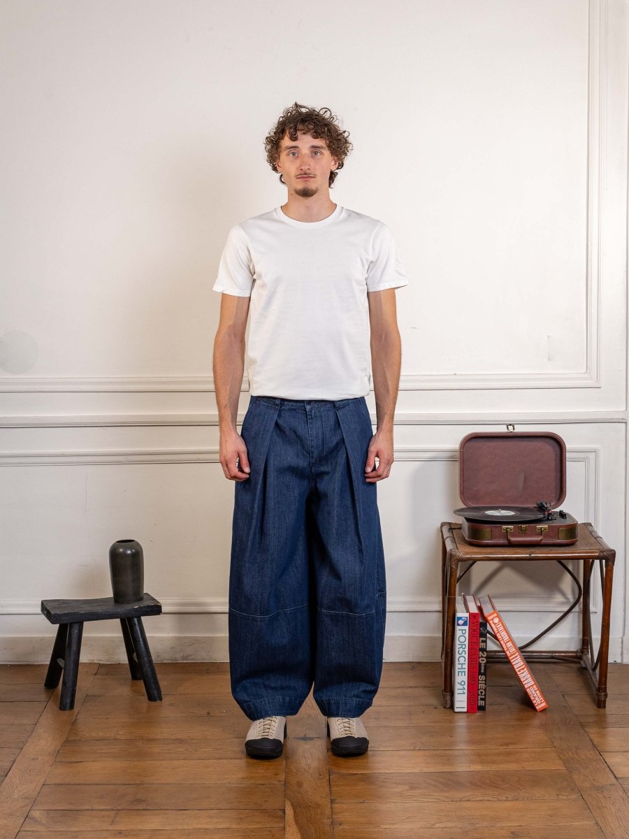 YMC Earth Deadbeat Trouser in indigo, worn, full-length front view