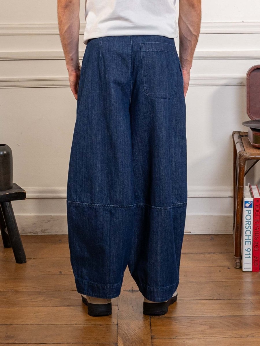 YMC Earth Deadbeat Trouser in indigo, worn, back view